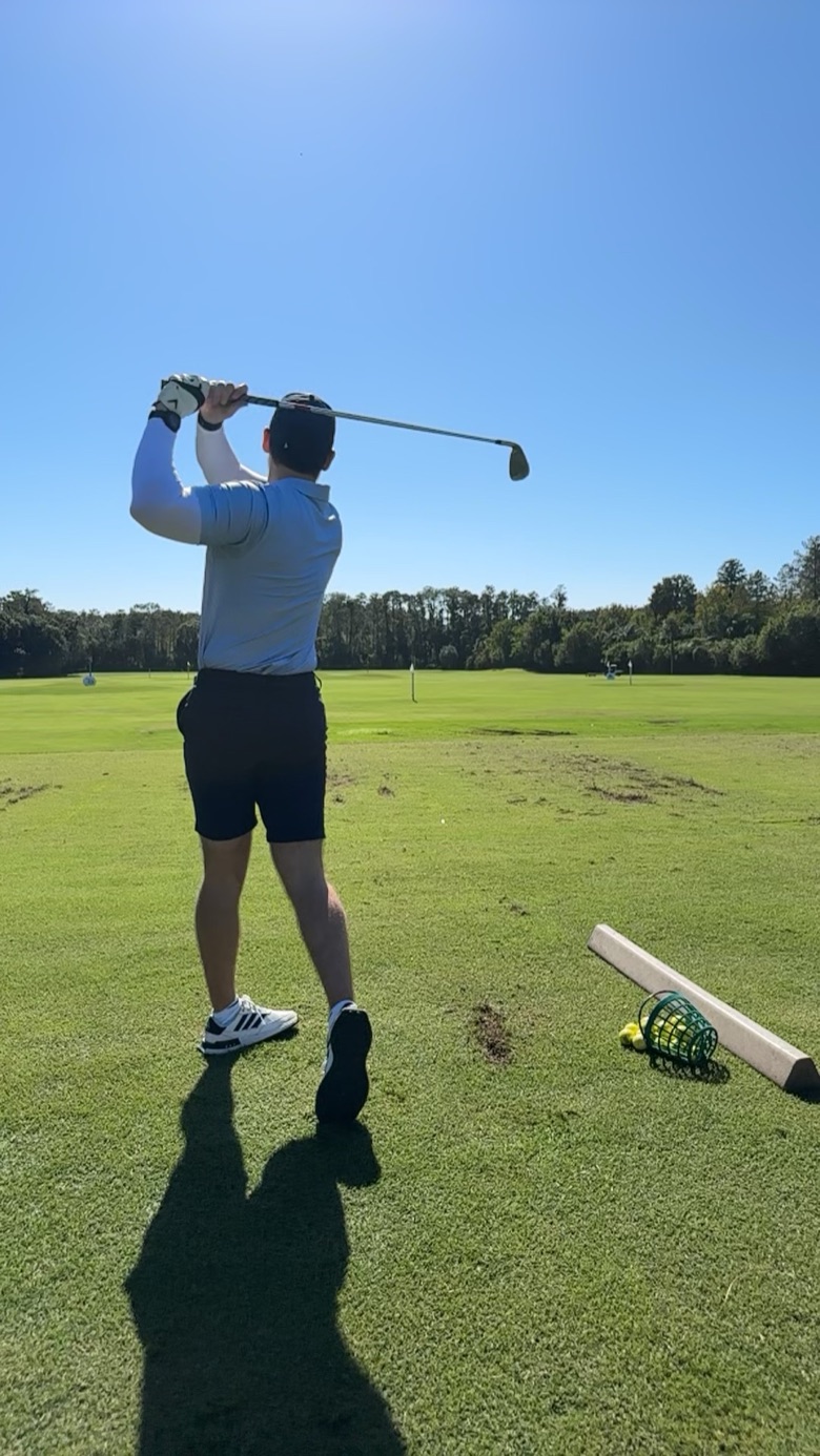 Chris holding his finish, the ball’s flight drawn up into the sky