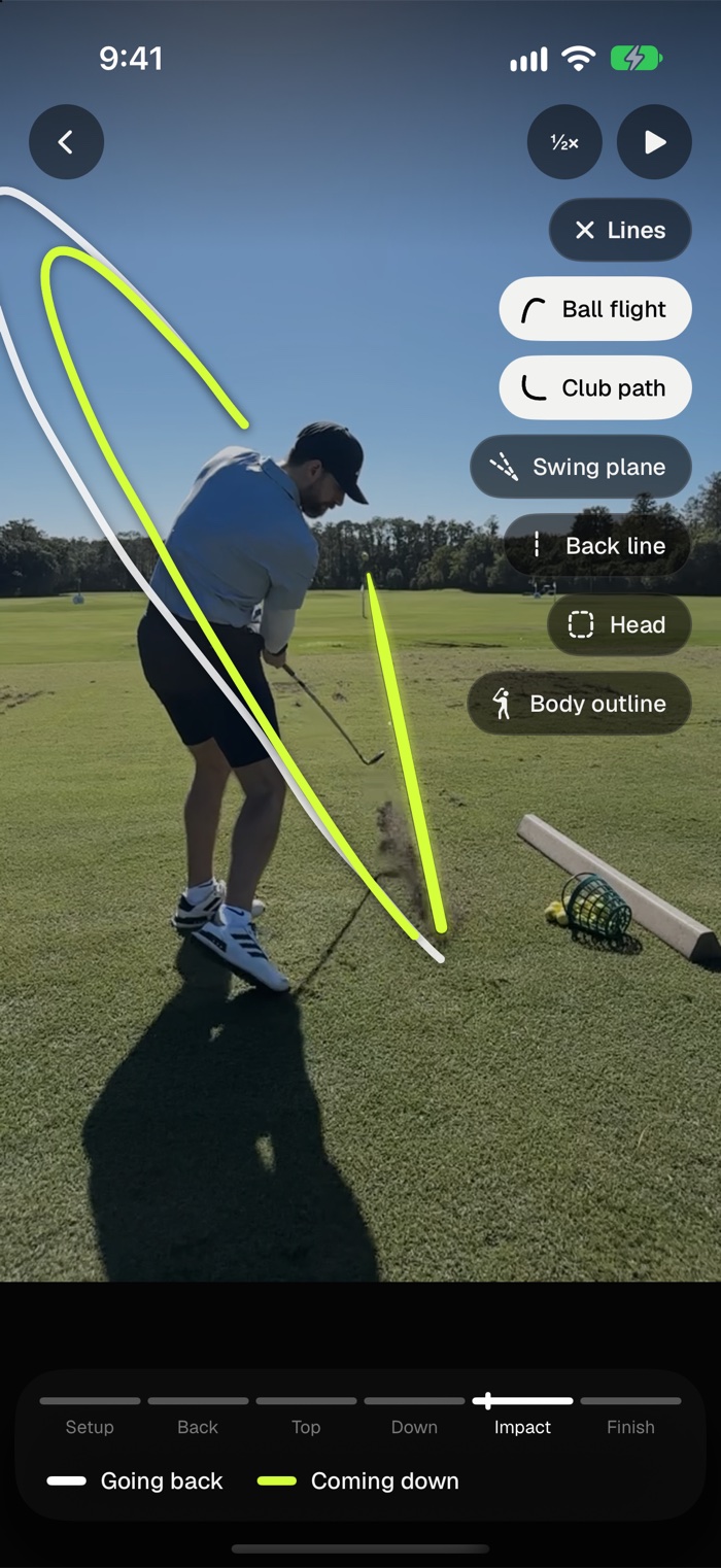 Watch just after impact with Lines open: the club path drawn white going back and lime coming down, and the ball’s flight starting